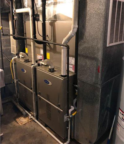 Technician installing a high-efficiency Trane AC unit in Winfield, WV